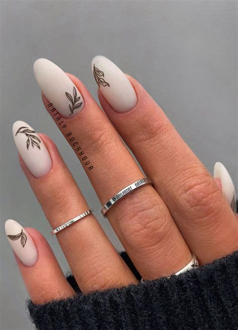 Creative And Pretty Nail Trends 2021 Black Leaf On Milky Nails