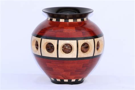 A Segmented Wooden Vase Made From Pieces Of Bloodwood Gabon Ebony