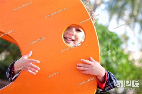 3 Year Old Boy Playing In A Playground Stock Photo Picture And Rights