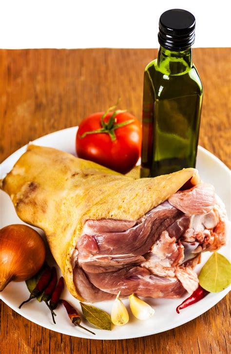 Raw Pork Shank On A Plate With Spices And Vegetables Stock Image