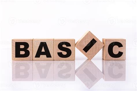 basic word text written  wooden cubes   white background