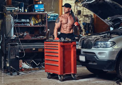 Shirtless Mechanic In A Garage Stock Photo Adobe Stock