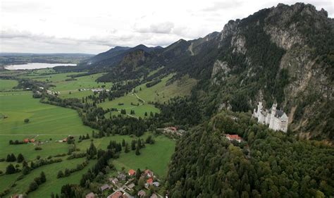 An Aerial View Of Neuschwanstein Castle And The Surrounding Area Near