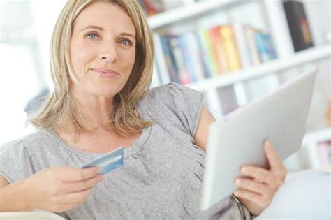 Shopping From The Comfort Of My Sofa Portrait Of An Attractive Mature