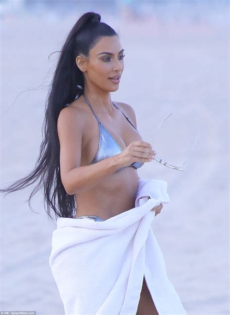 Kim Kardashian Flaunts Her Banging Body In Sexy Silver Bikini Poses In