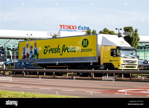 Morrisons Articulated Lorry Travelling Past The Tesco Extra Supermarket