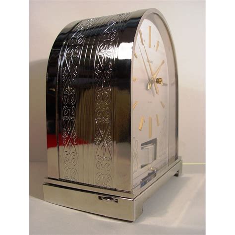 A Rare Rhodium Plated 1970s Swiss Bollard Model Atmos Clock In An Arch