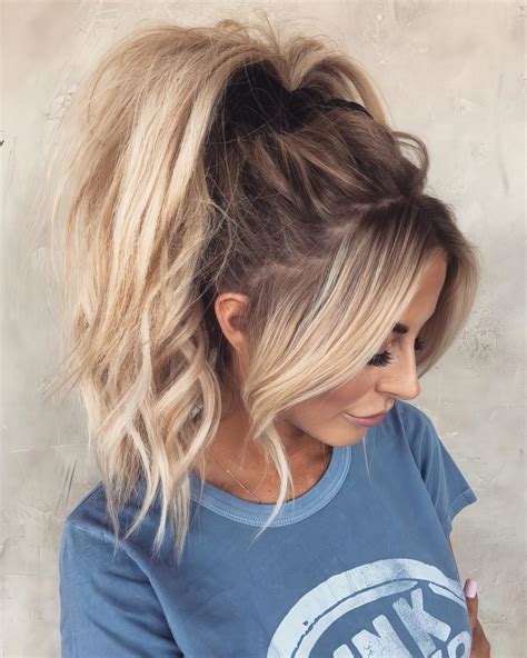 Picture Of a messy and wavy very high ponytail with wavy bangs is a girlish idea to try