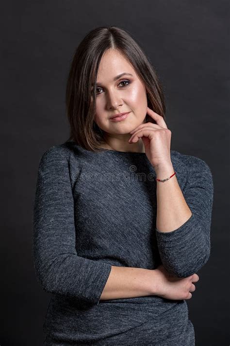 Makeup Brunette Girl In A Gray Dress With A White Collar On A White