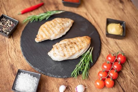 Premium Photo Grilled Chicken Fillet On Wooden Background