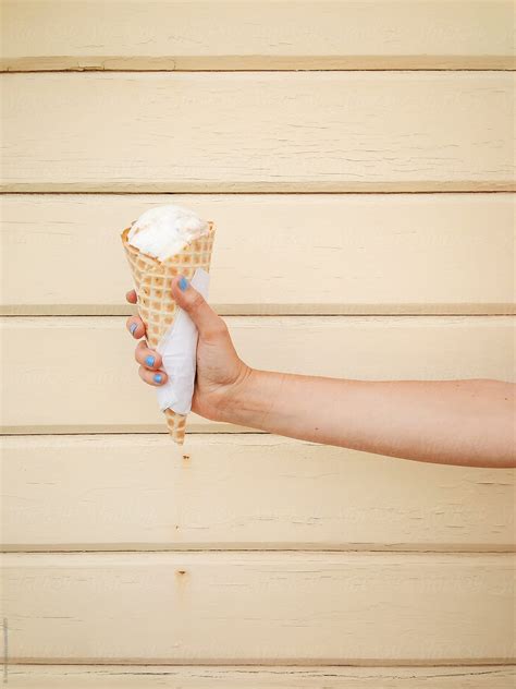 Ice Cream Cone In Hand Del Colaborador De Stocksy Branden Harvey