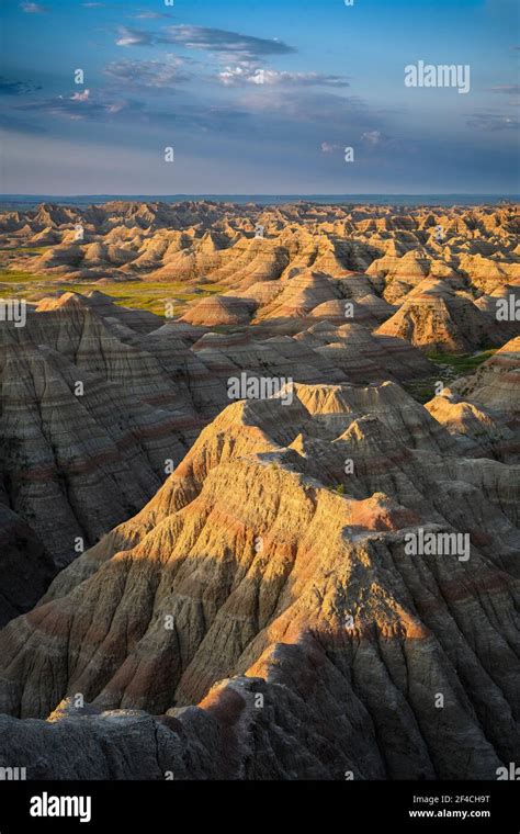 Sunrise Light Rakes The Eroded Pinnacles And Gullies At Big Badlands