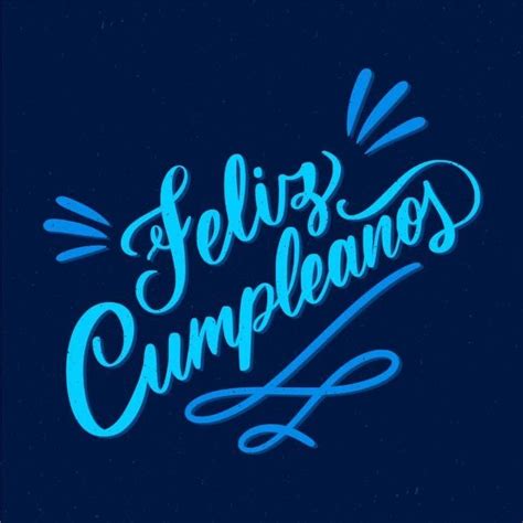 The Words Feliz Cumpleanos Written In Blue Ink On A Dark Background