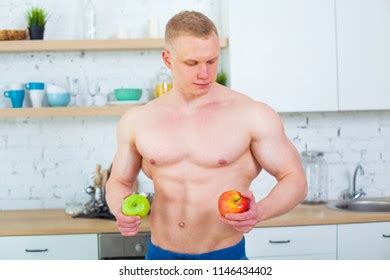 Muscular Man Naked Torso Kitchen Fruit Stock Photo 1146434402