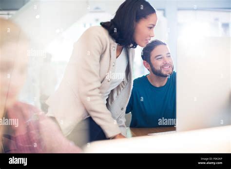 Business people using computer in office Stock Photo - Alamy