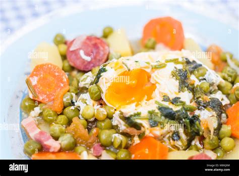 Traditional Portuguese Culinary Meal Of Green Peas With Egg Potatoes