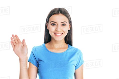 Portrait Of Attractive Positive Woman Waving To Camera Isolated On