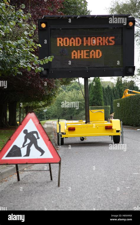 A Roadside Mobile Solar Powered Dot Matrix Road Sign Shows The Stock