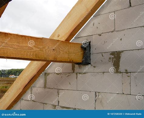 A Close Up On A Roofing Frame Construction Attaching Anchoring Roof