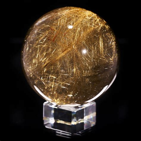 Polished Rutilated Quartz Sphere With Golden And Red Rutile Inclusions