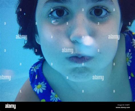 A girl holding her breath underwater Stock Photo - Alamy