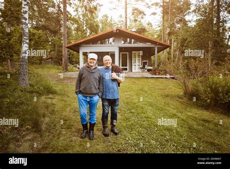 Portrait Of Happy Gay Couple Standing At Lawn Stock Photo Alamy