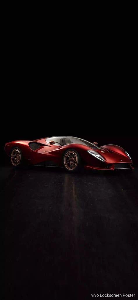 A Red Sports Car Sitting In The Dark