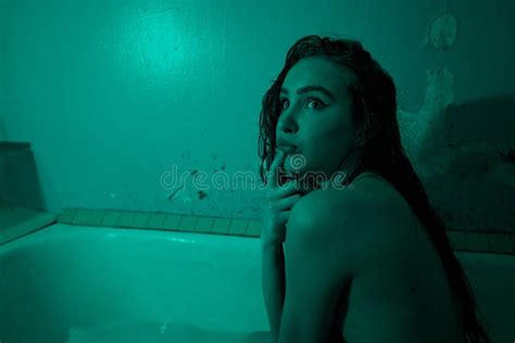 Playful Brunette Posing In A Bathtub Wearing Underwear In The Neon Light Stock Image Image Of