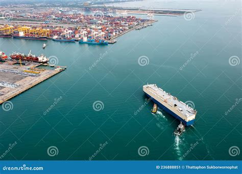 Roro Ship And Tugboat Sailing In Sea And Commercial Dock International