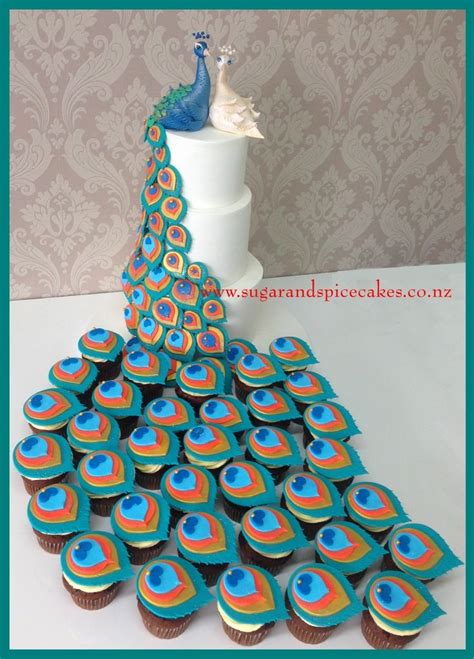 Peacock Wedding Cake With Matching Cupcakes Cakecentral Peacock