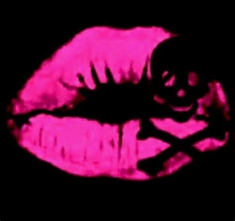 A Person S Lips Are Lit Up With Pink Light