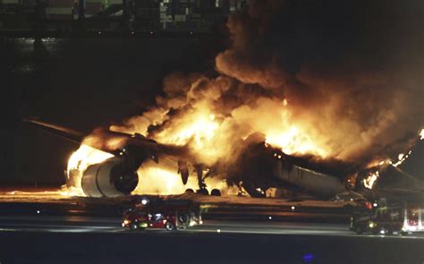 Horror Japan Airlines Plane With 379 On Board Collides With Other Plane Bursts Into Flames At