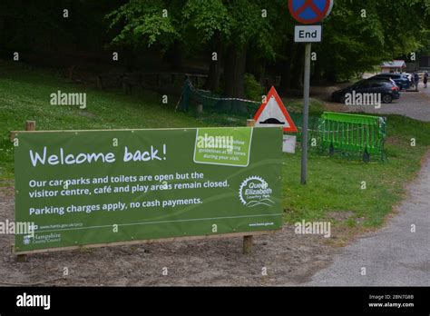 A Sign Welcoming Visitors Back To Queen Elizabeth Country Park Near