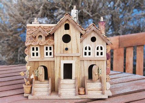 A Wooden Toy House Sitting On Top Of A Table