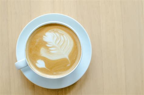 Premium Photo Hot Coffee On Wood Table In Coffee Shop