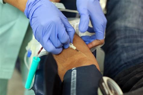 Premium Photo Cropped Image Of Doctor Preparing Patient For Blood