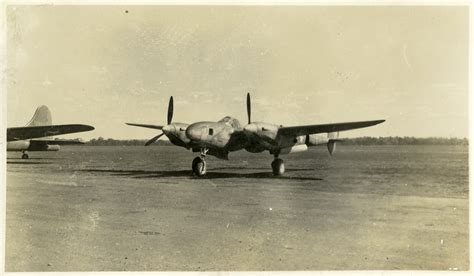 A Lockheed P 38 Lightning Sits On An Unknown Runway In The Pacific During World War Ii The