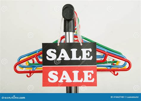 Close Up On Empty Hangers And A Big Sale Sign Stock Photo Image Of