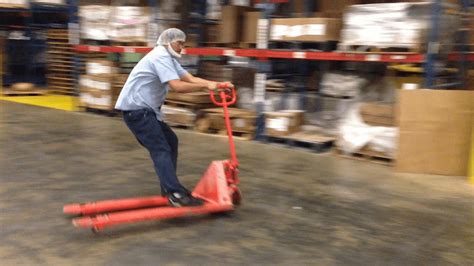 Worker Riding Pallet Jack Slides In Style On Reaching Destination Youtube