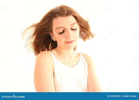 Portrait Of Caucasian Girl With Closed Eyes Posing Isolated On White