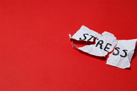 Premium Photo Paper With Word Stress On Red Background Space For Text