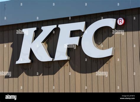 Kentucky Fried Chicken Sign On The Side Of A KFC Restaurant In