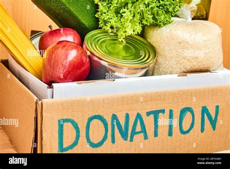 Donation Cardboard Box With Various Food Vegetables Fruits Cereals