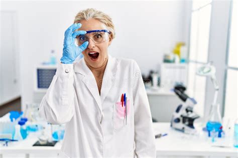 Middle Age Blonde Woman Working At Scientist Laboratory Doing Ok