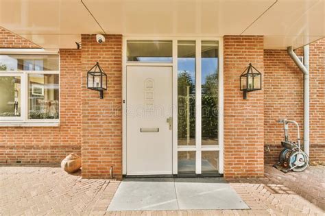 Front Door Of A Brick House With A White Door Stock Photo Image Of