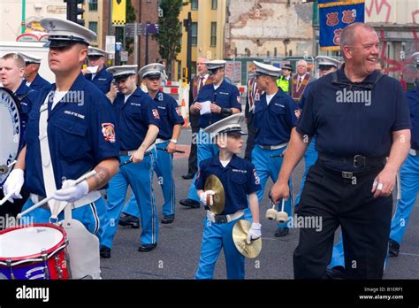 Members Of The Orange Lodge Parade Through The Streets Of Liverpool UK