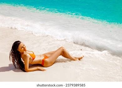Woman Wearing Orange Bikini Lying On Stock Photo 2379389585 Shutterstock