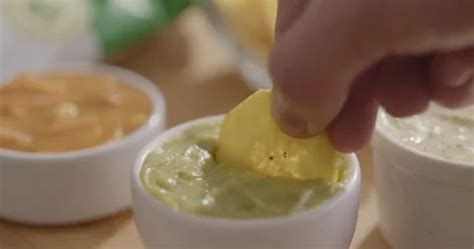 Plantain Chips Dipping into Sauce - Appe... | Stock Video | Pond5