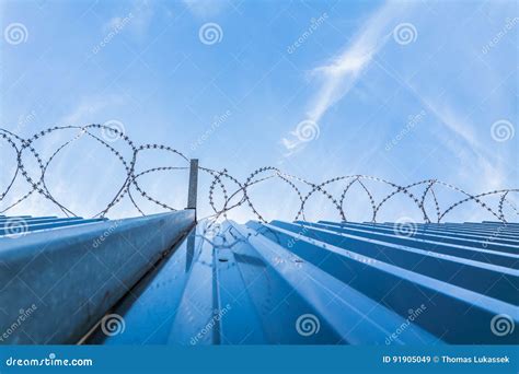 Fence with Barb Wire and Blue Sky Stock Image - Image of iron, liberty: 91905049