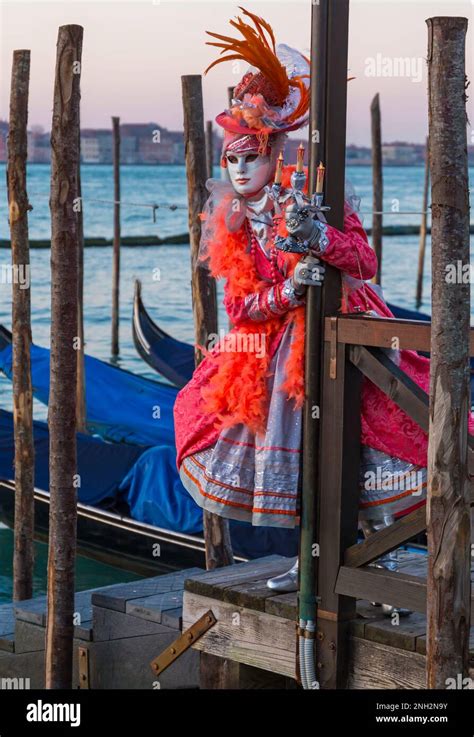 Carnival Goer Dressed In Splendid Costume And Mask During Venice